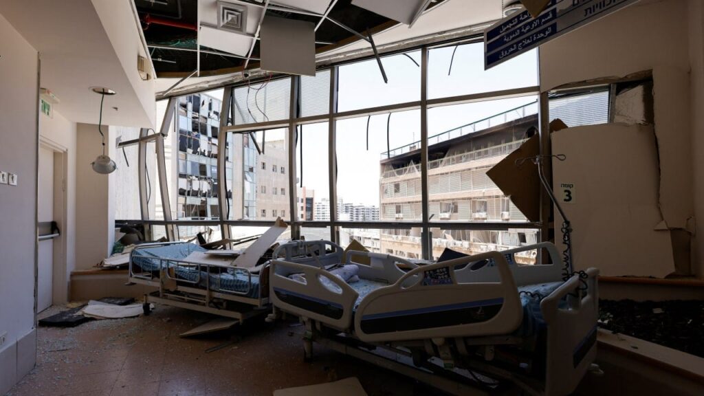 A damaged patient ward at Soroka Hospital with broken walls and scattered beds after the June 2025 missile strike.